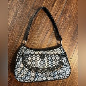 Purse with metallic “G”. Vintage Guess?  I honestly don’t know.